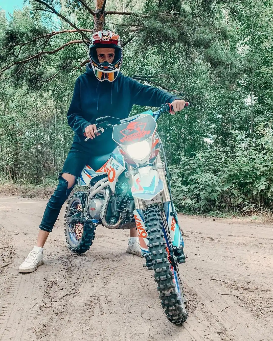 Roman sitting on a motorcycle in riding gear